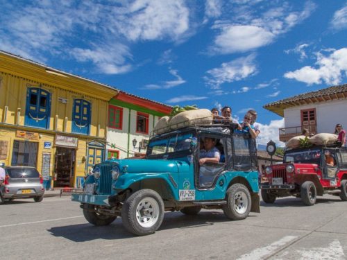 Willys with passengers on main square of Salento
