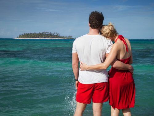 Couple hugging in front of Caribbean sea