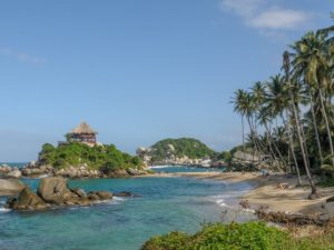 Cabo San Juan with palmtrees and beach in front of blue water - Landscape - Tayrona - Lulo Colombia Travel