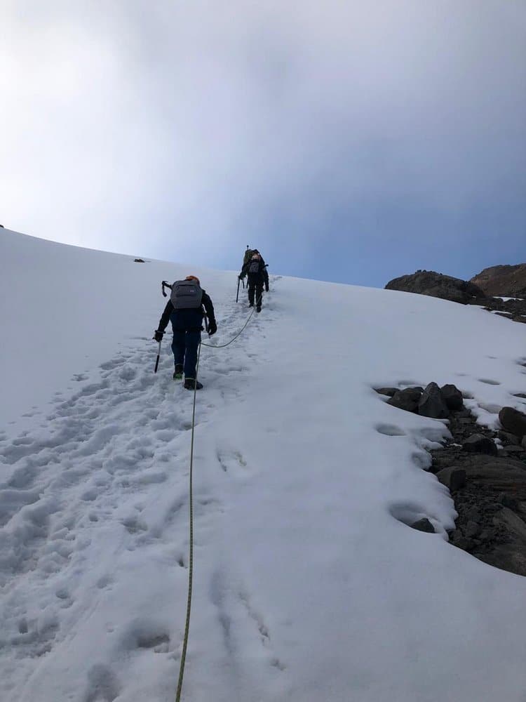 Tourist climbing on Santa Isabel Glacier tour