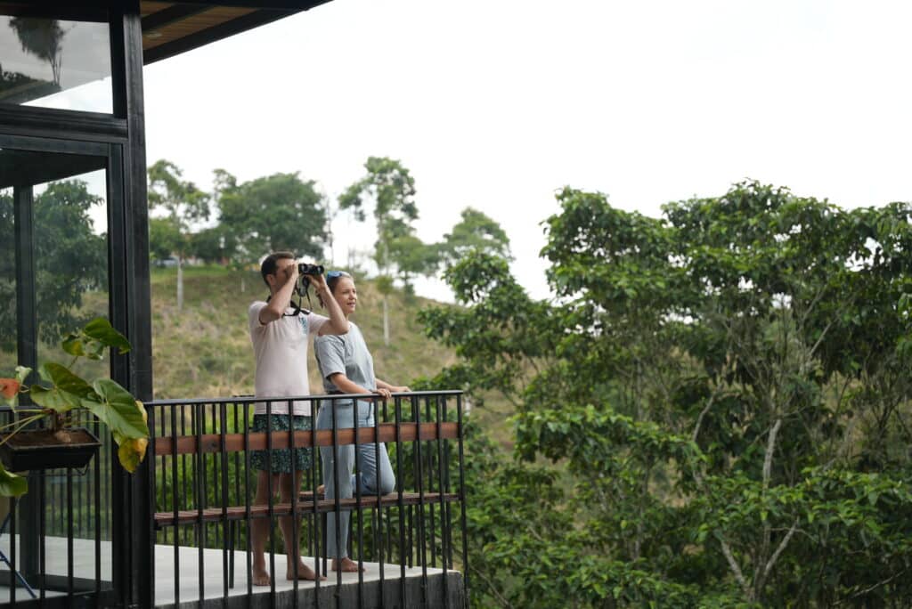 Scenic view of Reverie Lodge in the Coffee Region, Colombia, surrounded by lush gardens and rolling hill
